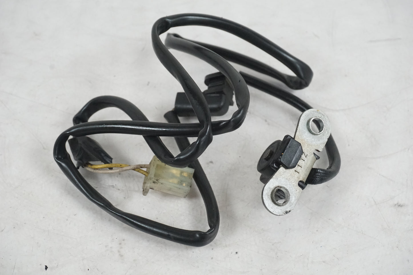 Snett nerifrån på Tändpickup från en Honda XRV 750 -1999 motorcykel.