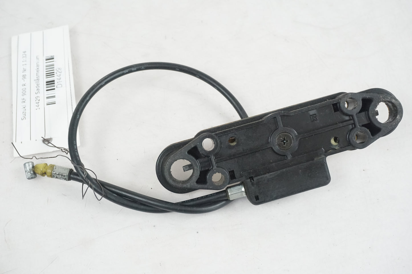 Baksidan på Sadellåsmekanism från en Suzuki RF 900 R -1998 motorcykel.