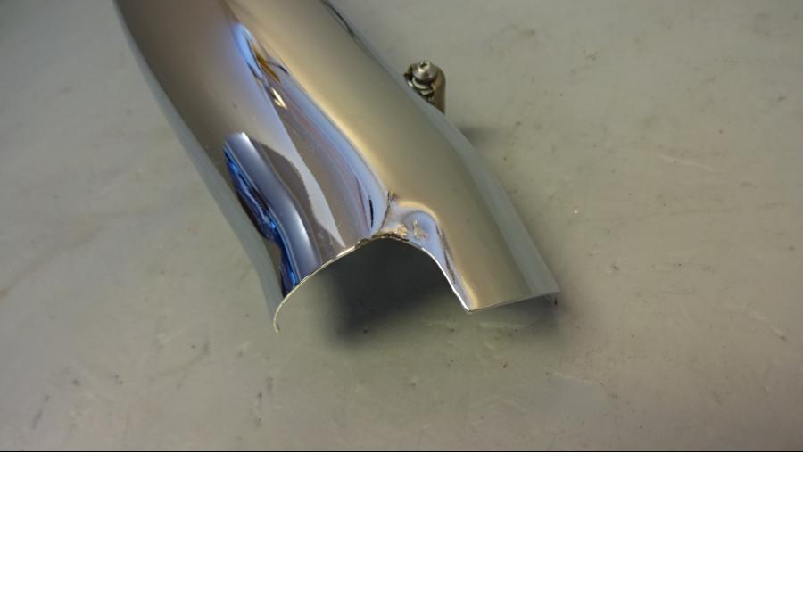 Vänster sida på Värmeskydd från en H-D Softail -2006 motorcykel.