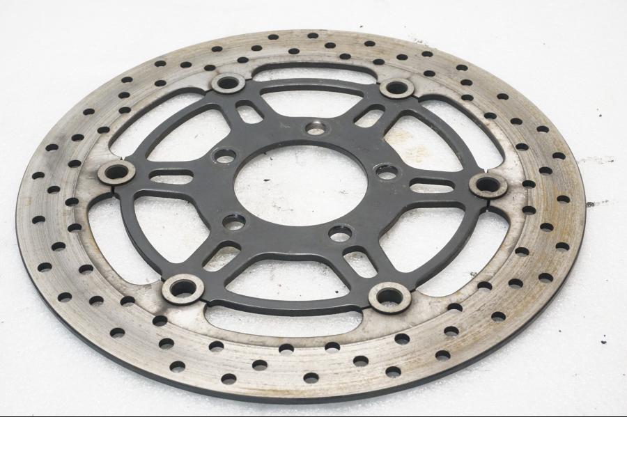 Framsidan på Bromsskiva från en Suzuki SV 650 -2006 motorcykel.