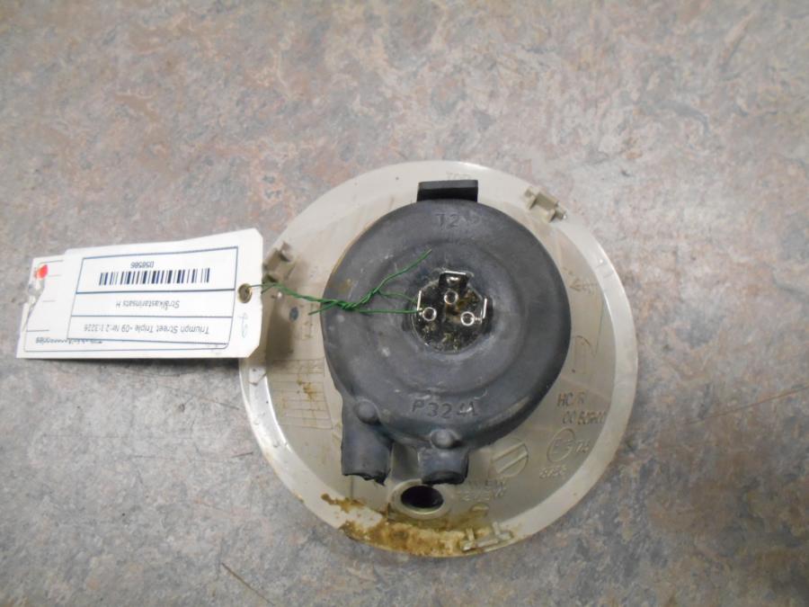 Baksidan på Strålkastarinsats från en Triumph Street Triple -2009 motorcykel.