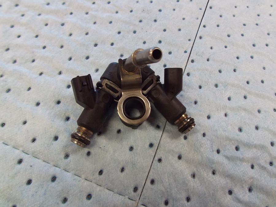 Framsidan på Spjällhus från en H-D Softail Deluxe / Nostalgia FLSTN -2011 motorcykel.