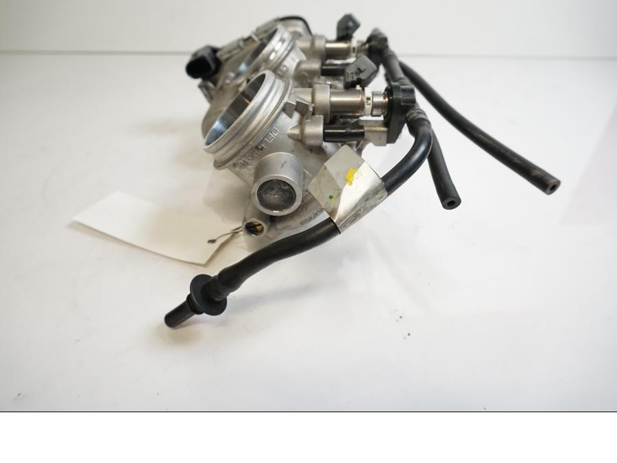 Vänster sida på Spjällhus från en Aprilia Tuono V4R -2018 motorcykel.