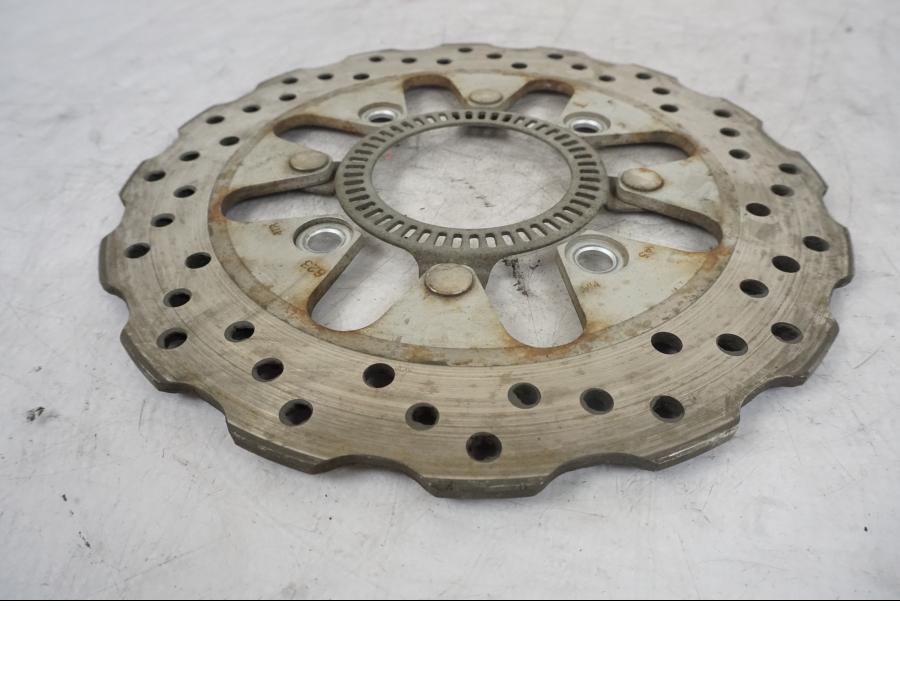 Vänster sida på Bromsskiva från en Kawasaki Versys 650 -2014 motorcykel.