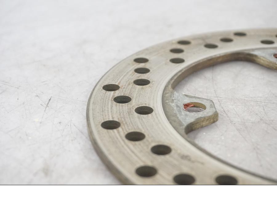 Vänster sida på Bromsskiva från en Kawasaki ZX-6R -1999 motorcykel.