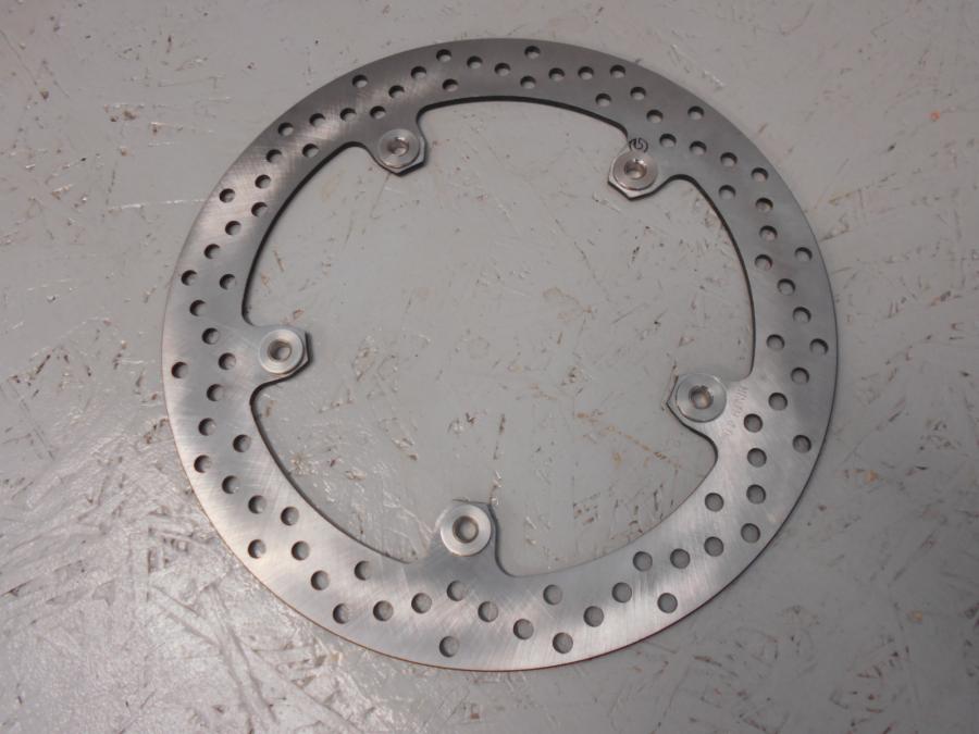 Framsidan på <p>fram, Brembo 320 x 4,45mm, nyckick. okänd modell</p>
<p>Bultcirkel 205mm</p> motorcykel.