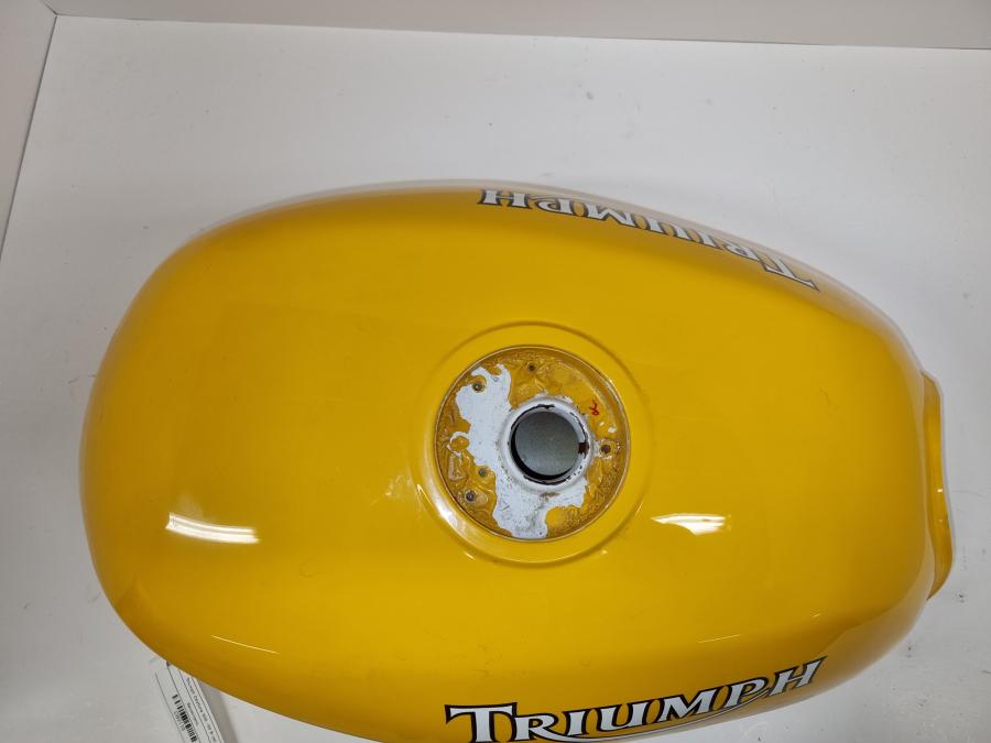 Snett uppifrån på Bensintank från en Triumph Alla -1999 motorcykel.
