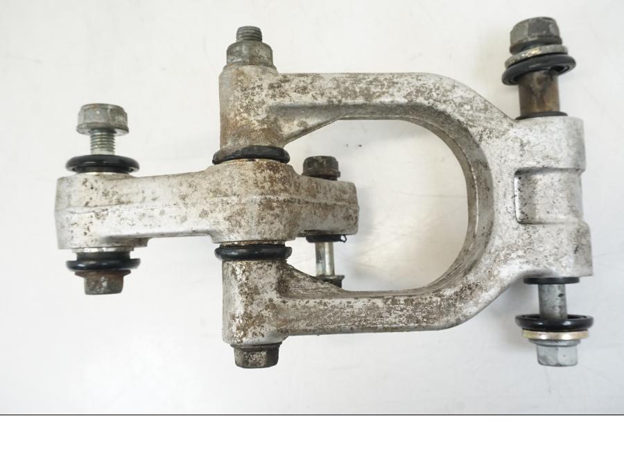 Vänster sida på Stötdämparlänkage från en Honda NSR 125 -1991 motorcykel.