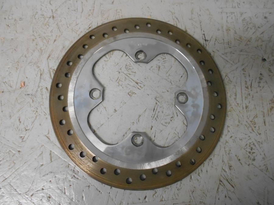 Framsidan på Bromsskiva från en Triumph Bonneville -2001 motorcykel.