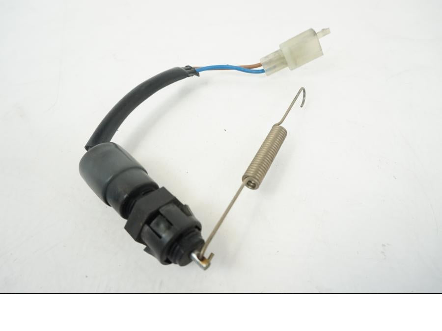 Snett uppifrån på Bromsljuskontakt från en Triumph Speed Triple -2009 motorcykel.