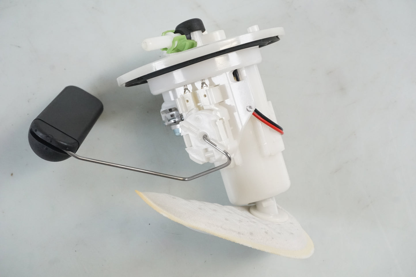 Framsidan på Bensinpump insprut från en Honda ANF 125 -2008 motorcykel.