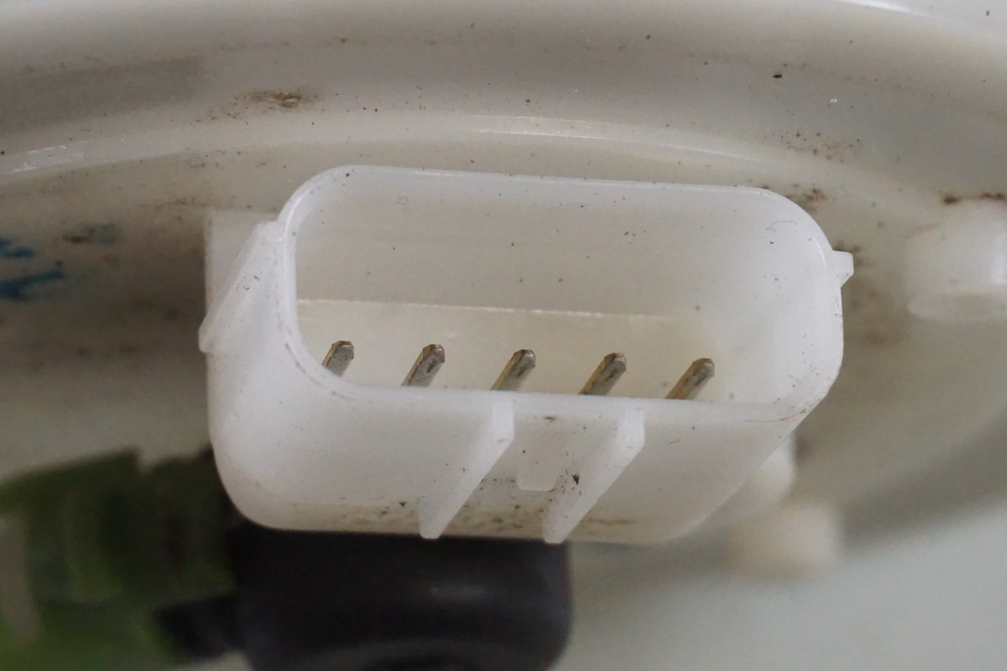 Höger sida på Bensinpump insprut från en Honda ANF 125 -2009 motorcykel.