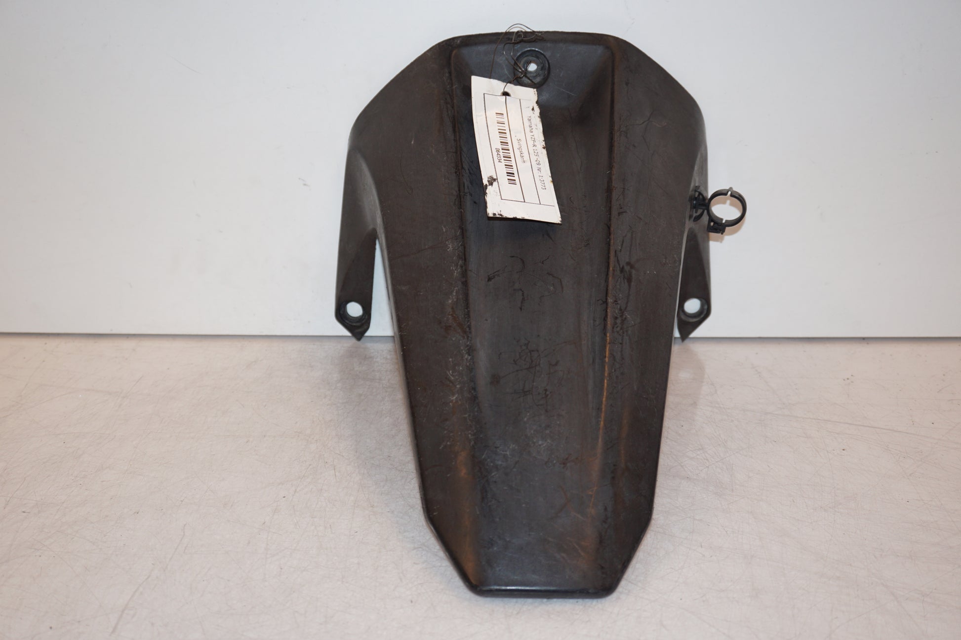 Vänster sida på Svingskärm från en Yamaha YZF-R 125 -2009 motorcykel.