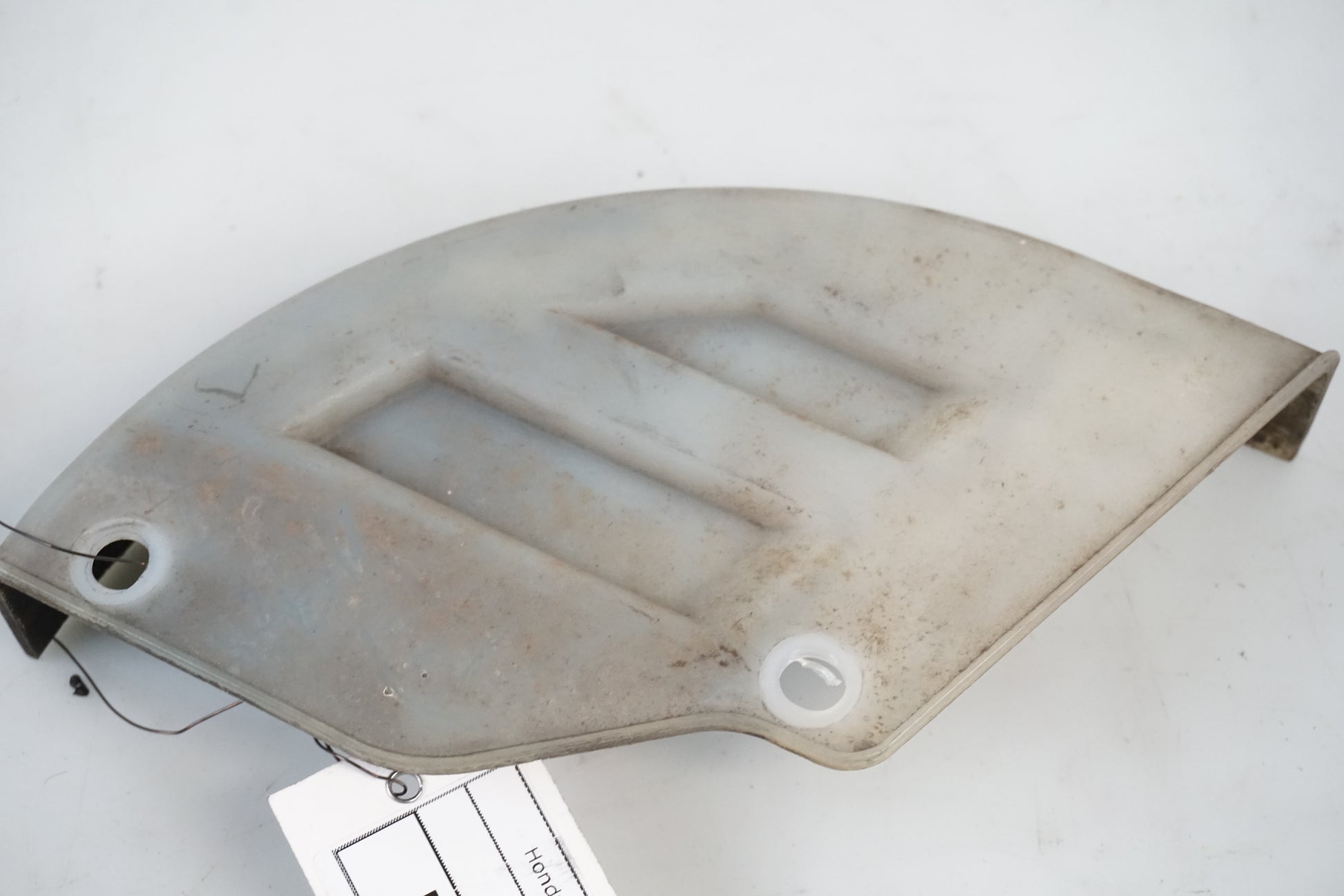 Vänster sida på Skivbromsplast från en Honda XRV 750 -1999 motorcykel.