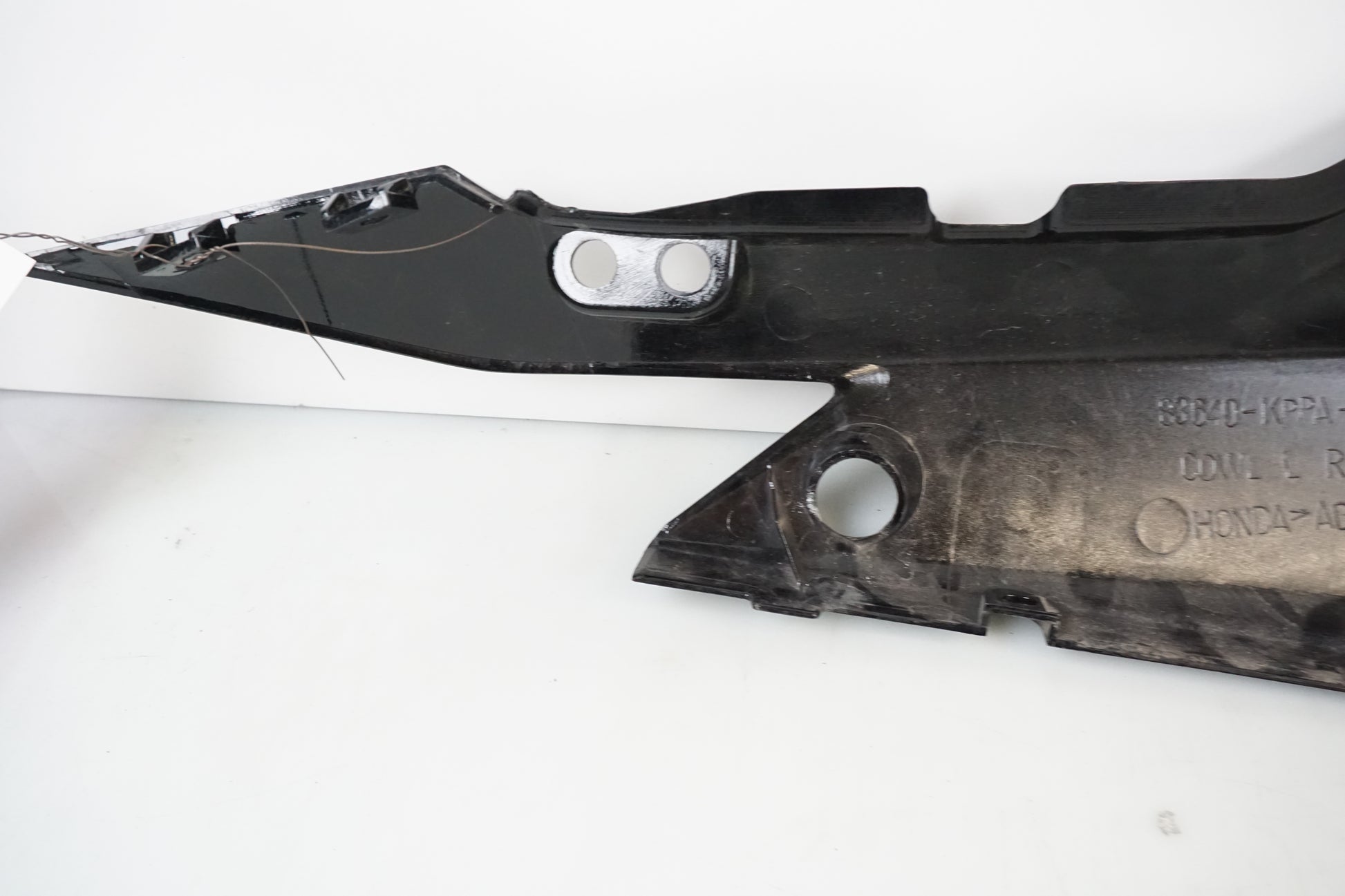 Höger sida på Bakvinge från en Honda CBR 125 R -2004 motorcykel.