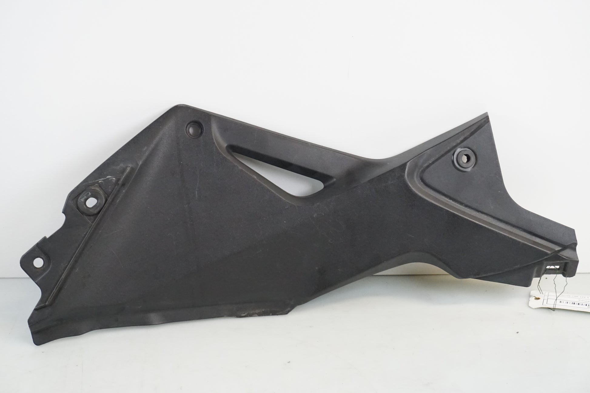 Framsidan på Sidopanel från en Honda CBR 125 R -2011 motorcykel.