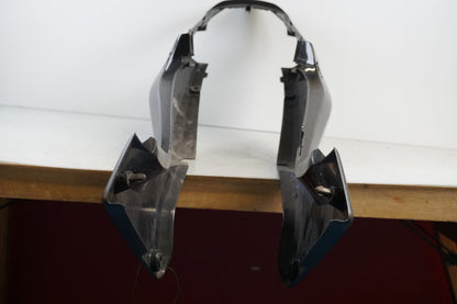 Vänster sida på Bakvinge från en Honda CBR 125 R -2004 motorcykel.