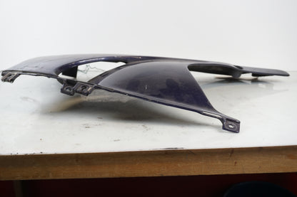 Vänster sida på Magkåpa från en Honda CBR 900 RR -1999 motorcykel.