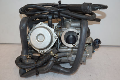 Vänster sida på Förgasare från en Honda XL 650 V -2000 motorcykel.