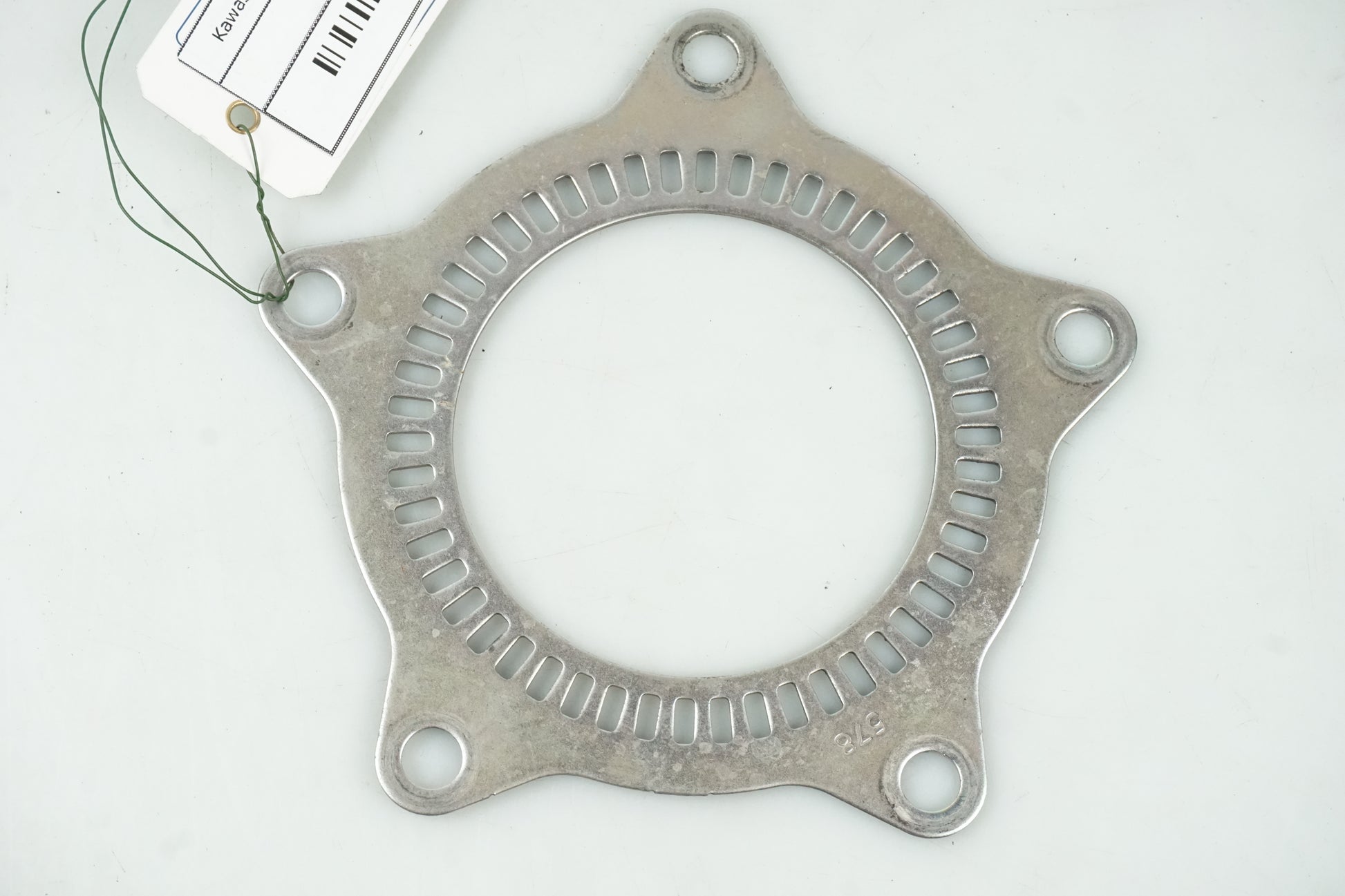 Framsidan på ABS krans från en Kawasaki Ninja 300 -2013 motorcykel.