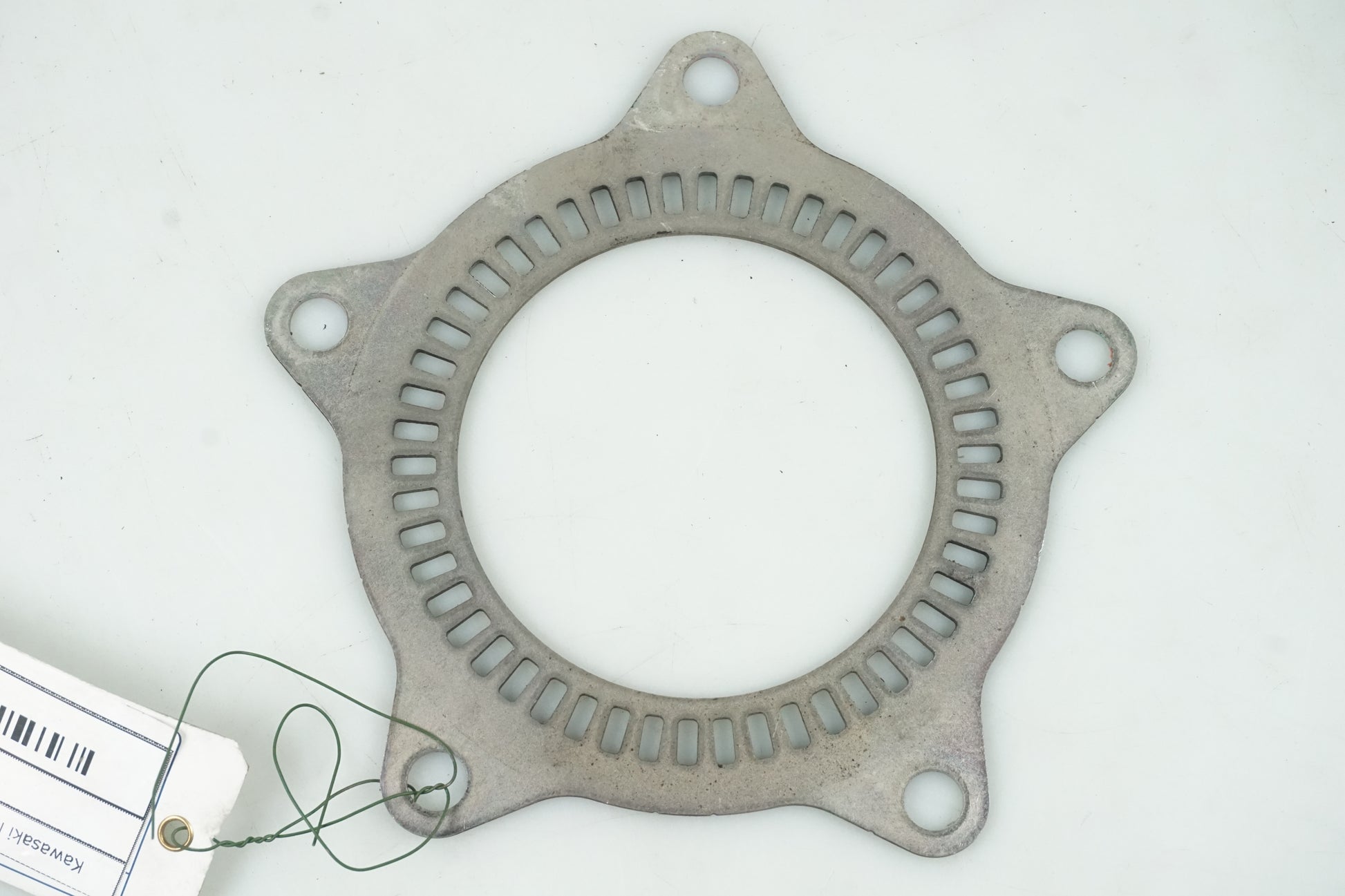 Framsidan på ABS krans från en Kawasaki Ninja 300 -2014 motorcykel.