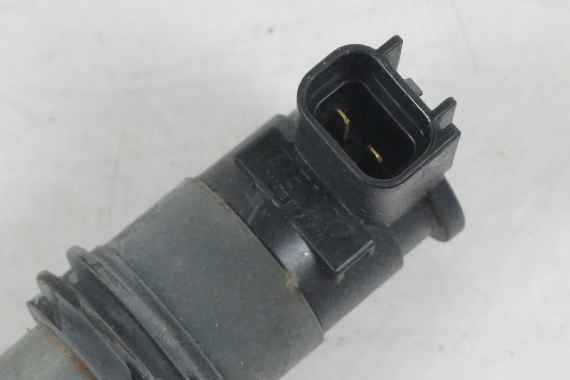 Baksidan på Tändspole från en Suzuki GSF 650 -2011 motorcykel.