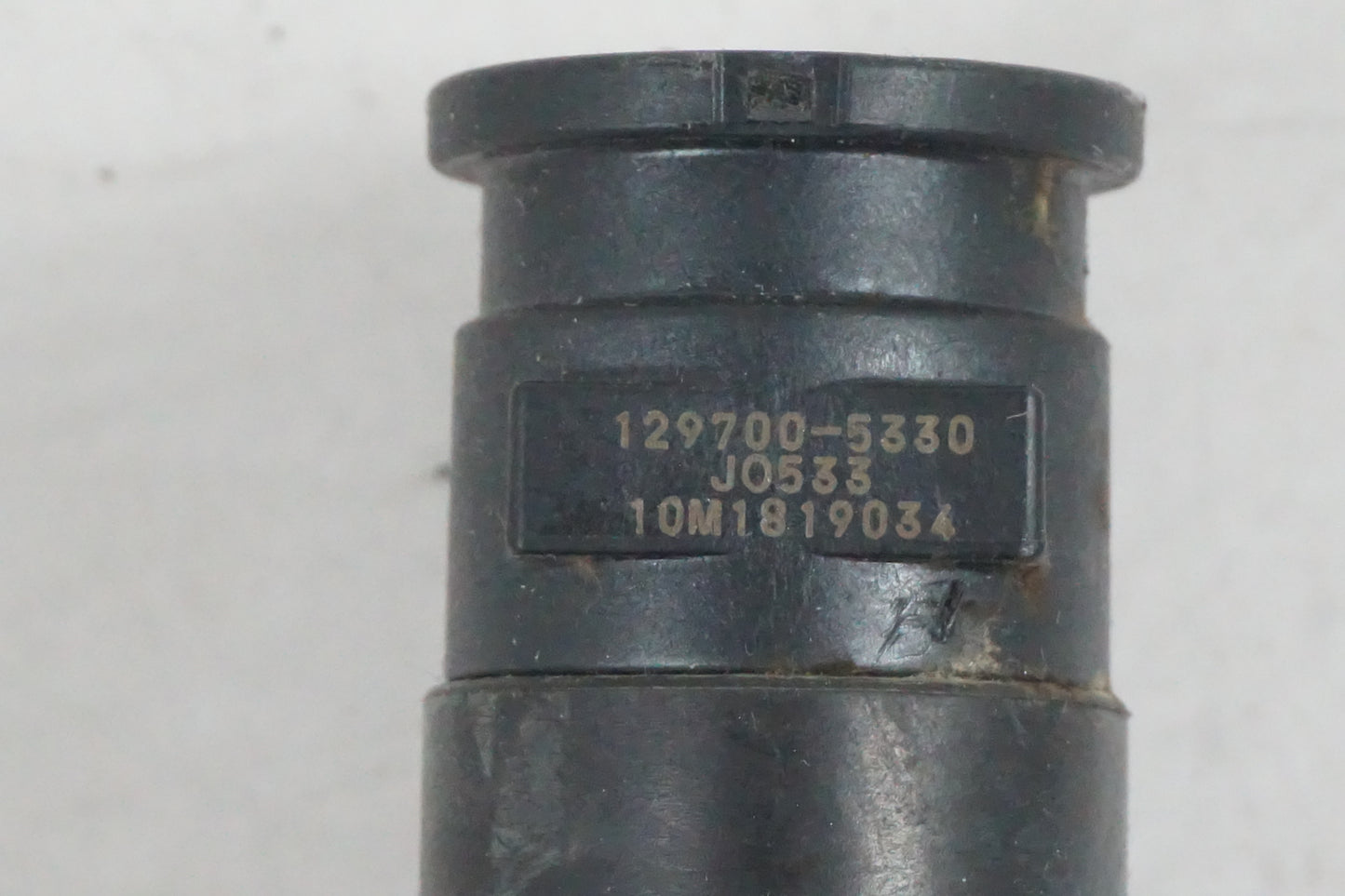 Vänster sida på Tändspole från en Suzuki GSF 650 -2011 motorcykel.