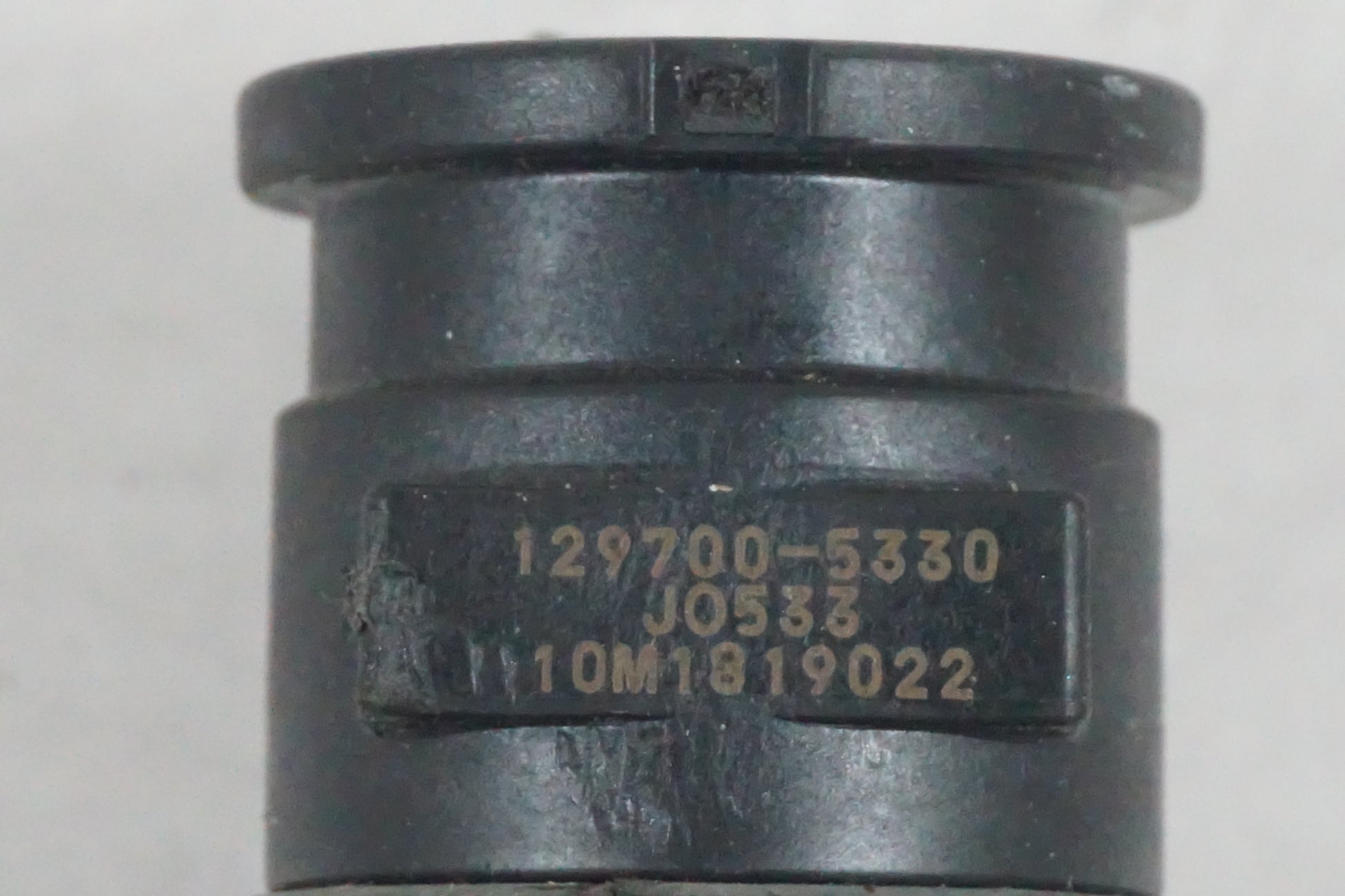 Vänster sida på Tändspole från en Suzuki GSF 650 -2011 motorcykel.