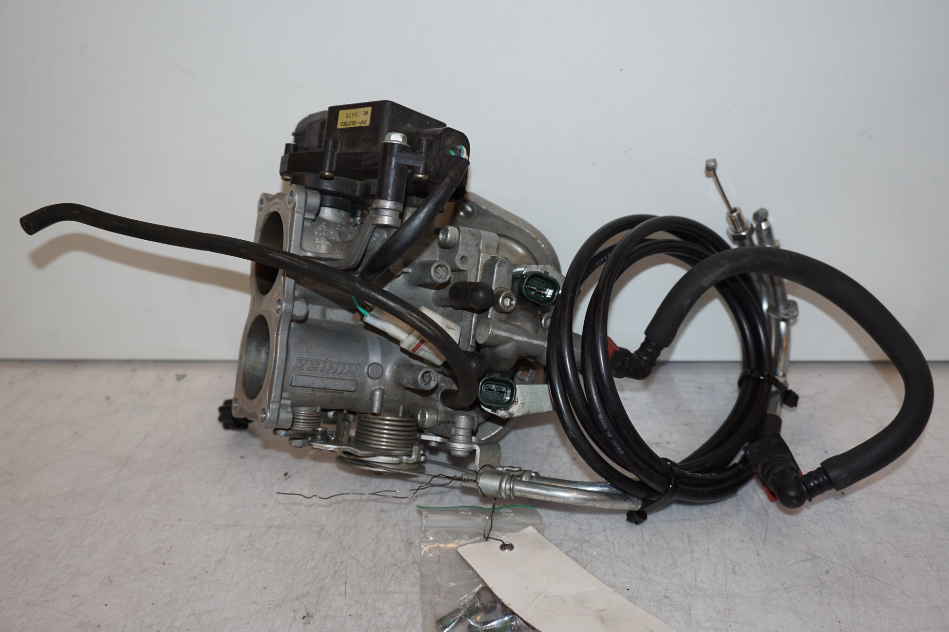 Framsidan på Spjällhus från en Kawasaki VN 900 -2007 motorcykel.