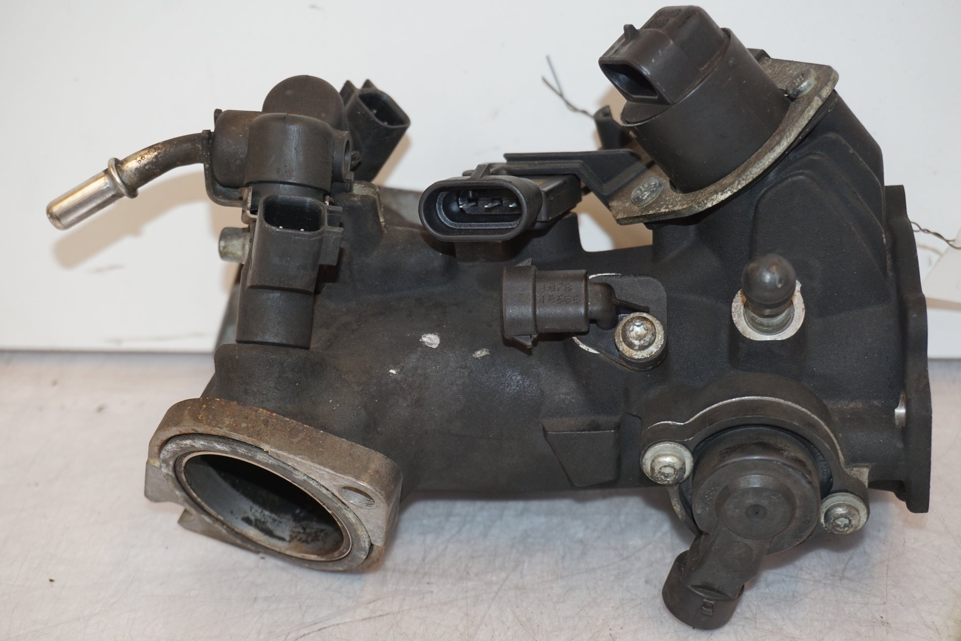 Framsidan på Spjällhus från en H-D Dyna Street Bob FXDB/I -2007 motorcykel.