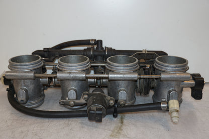 Vänster sida på Spjällhus från en BMW K 1200 S -2006 motorcykel.