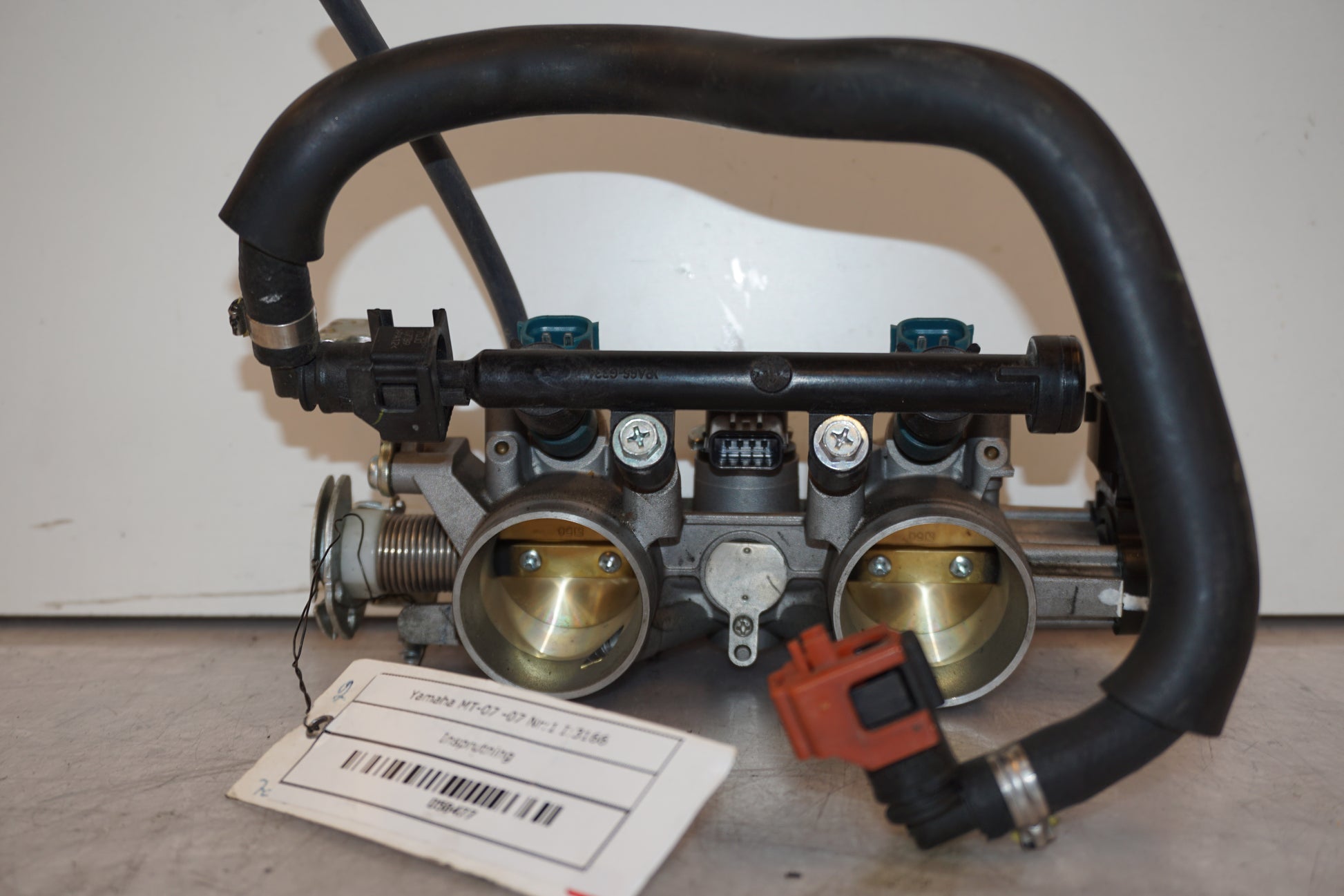 Framsidan på Spjällhus från en Yamaha MT-07 -2014 motorcykel.