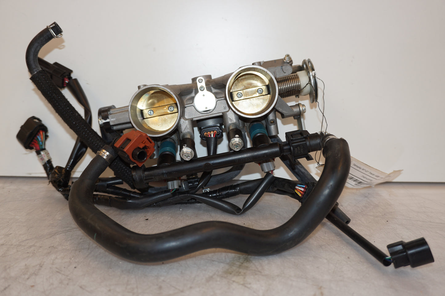 Framsidan på Spjällhus från en Yamaha MT-07 Tracer -2016 motorcykel.