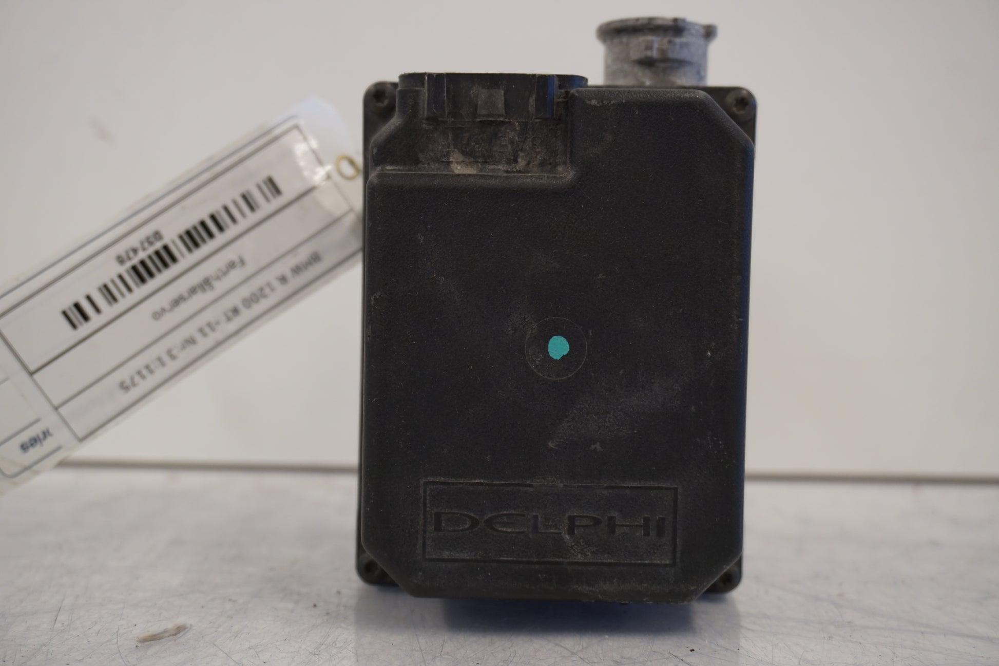 Framsidan på Farthållarservo från en BMW R 1200 RT -2011 motorcykel.