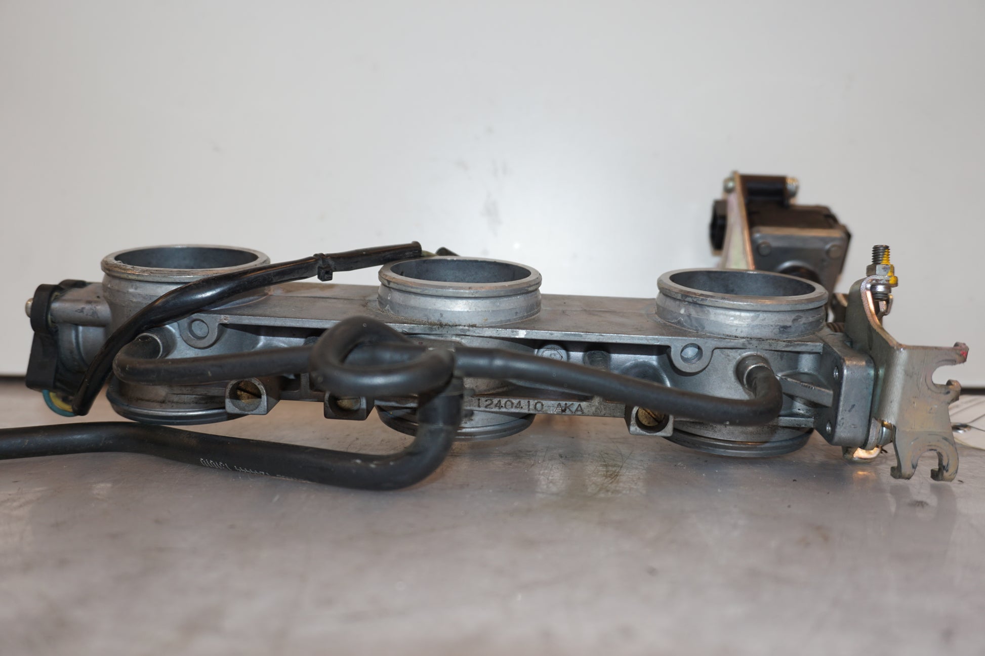 Baksidan på Spjällhus från en Triumph Speed Triple -2011 motorcykel.