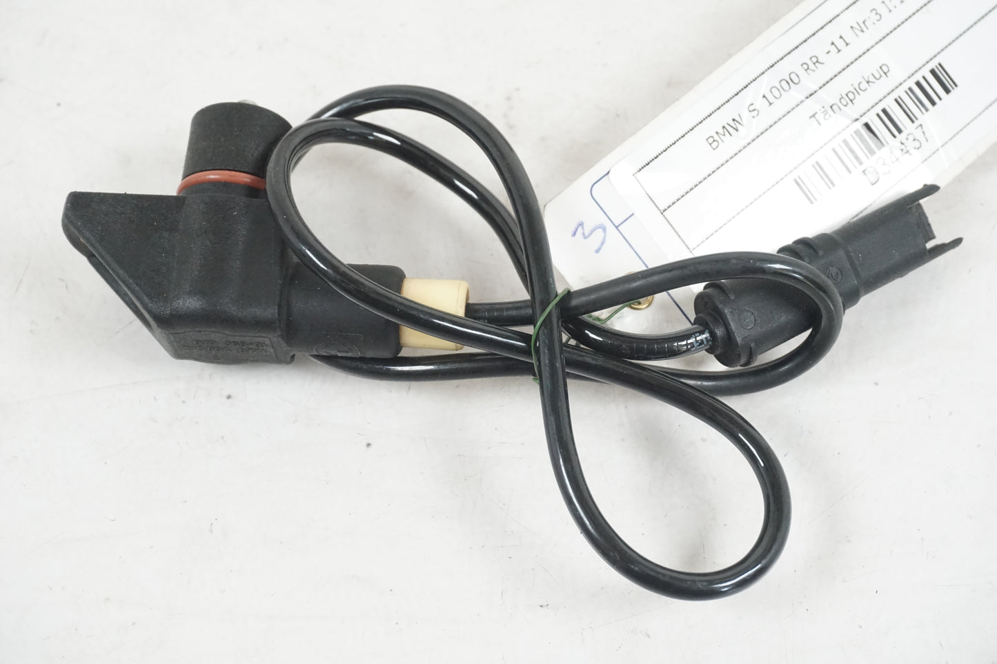 Framsidan på Tändpickup från en BMW S 1000 RR -2011 motorcykel.