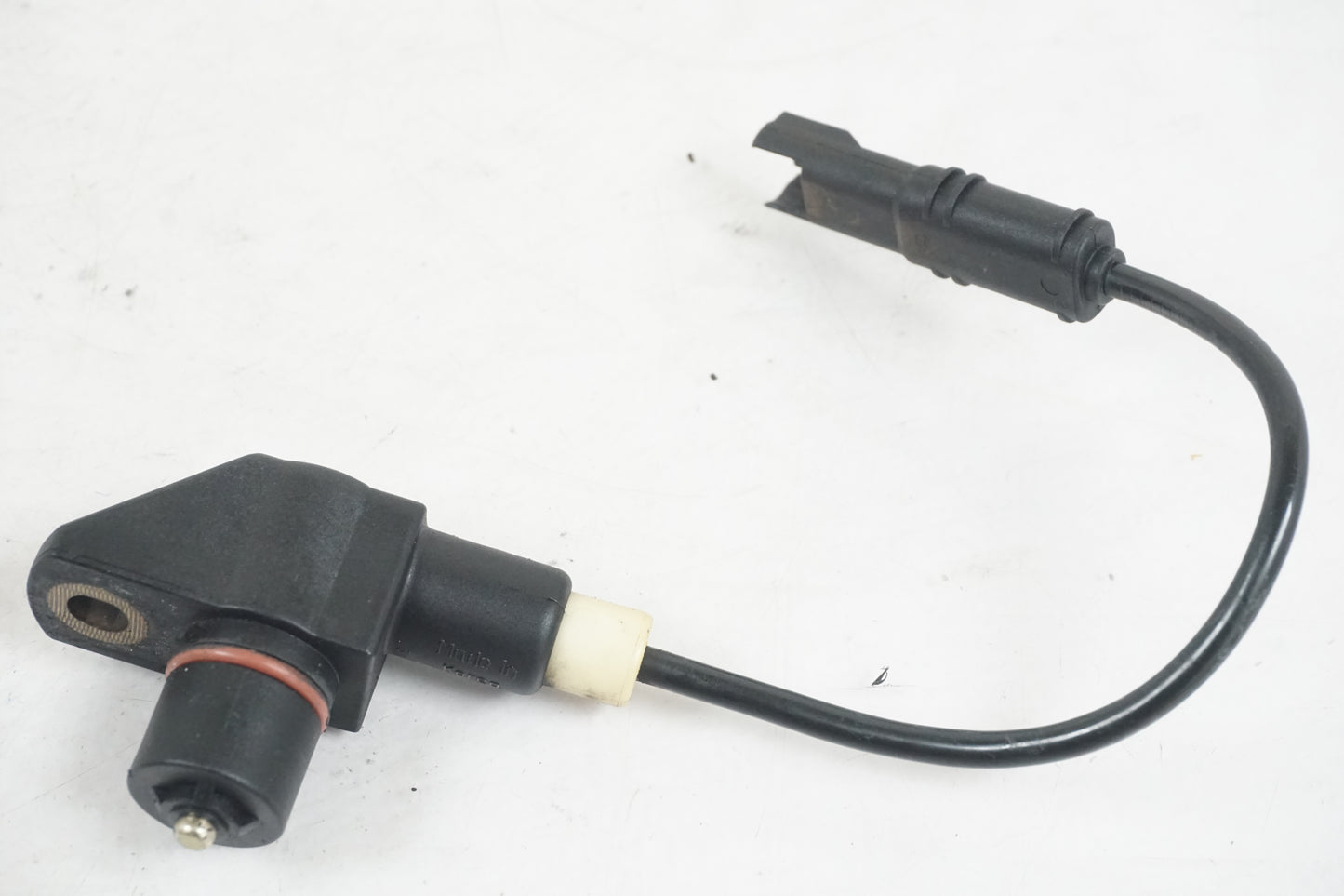 Framsidan på Vevaxelsensor från en BMW R 1200 R -2007 motorcykel.