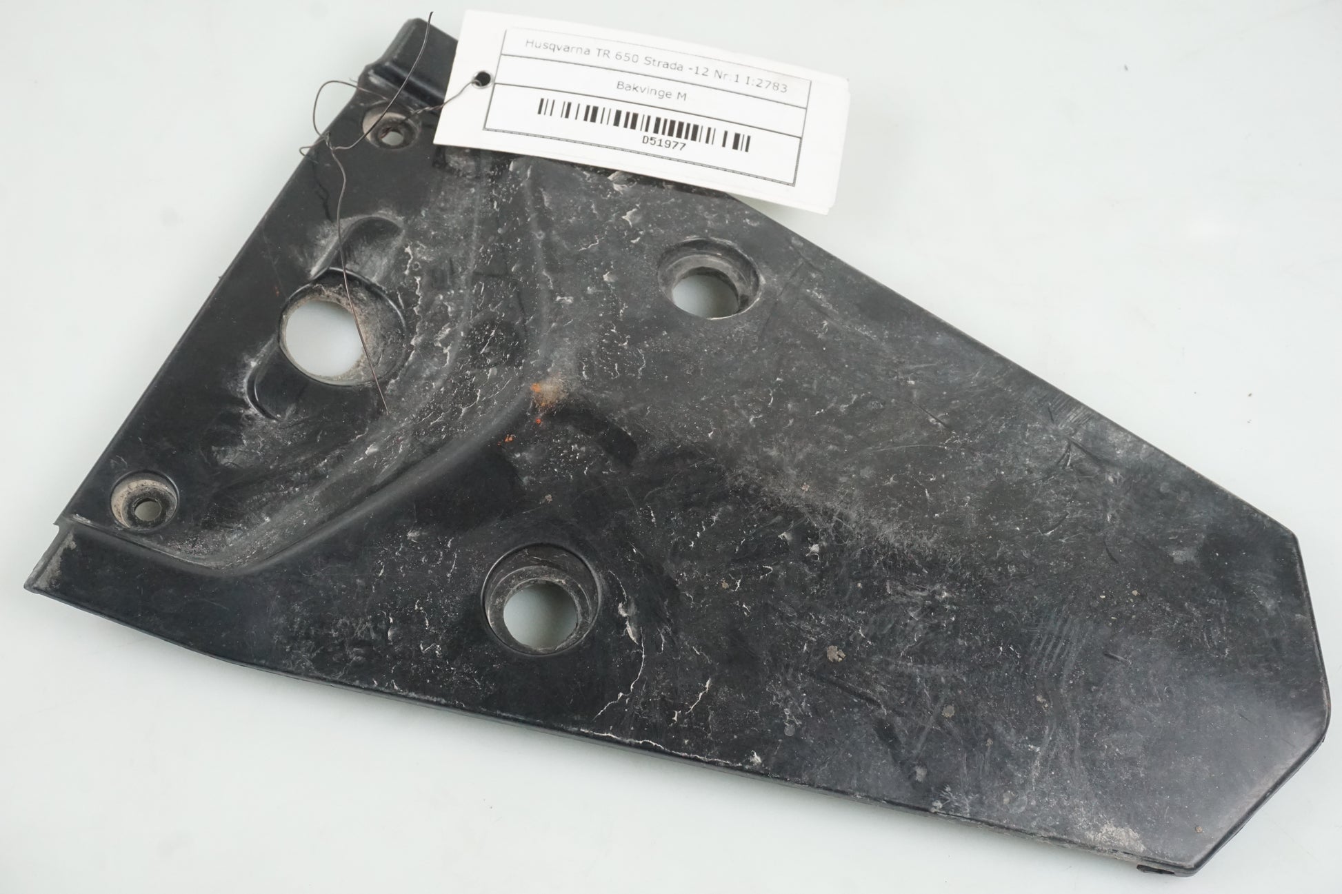 Framsidan på Bakvinge från en Husqvarna TR 650 Strada -2012 motorcykel.