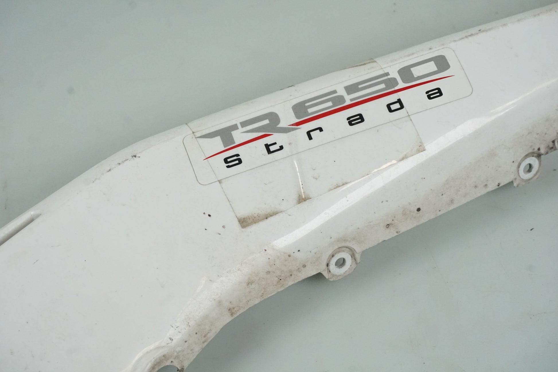 Höger sida på Bakvinge från en Husqvarna TR 650 Strada -2012 motorcykel.