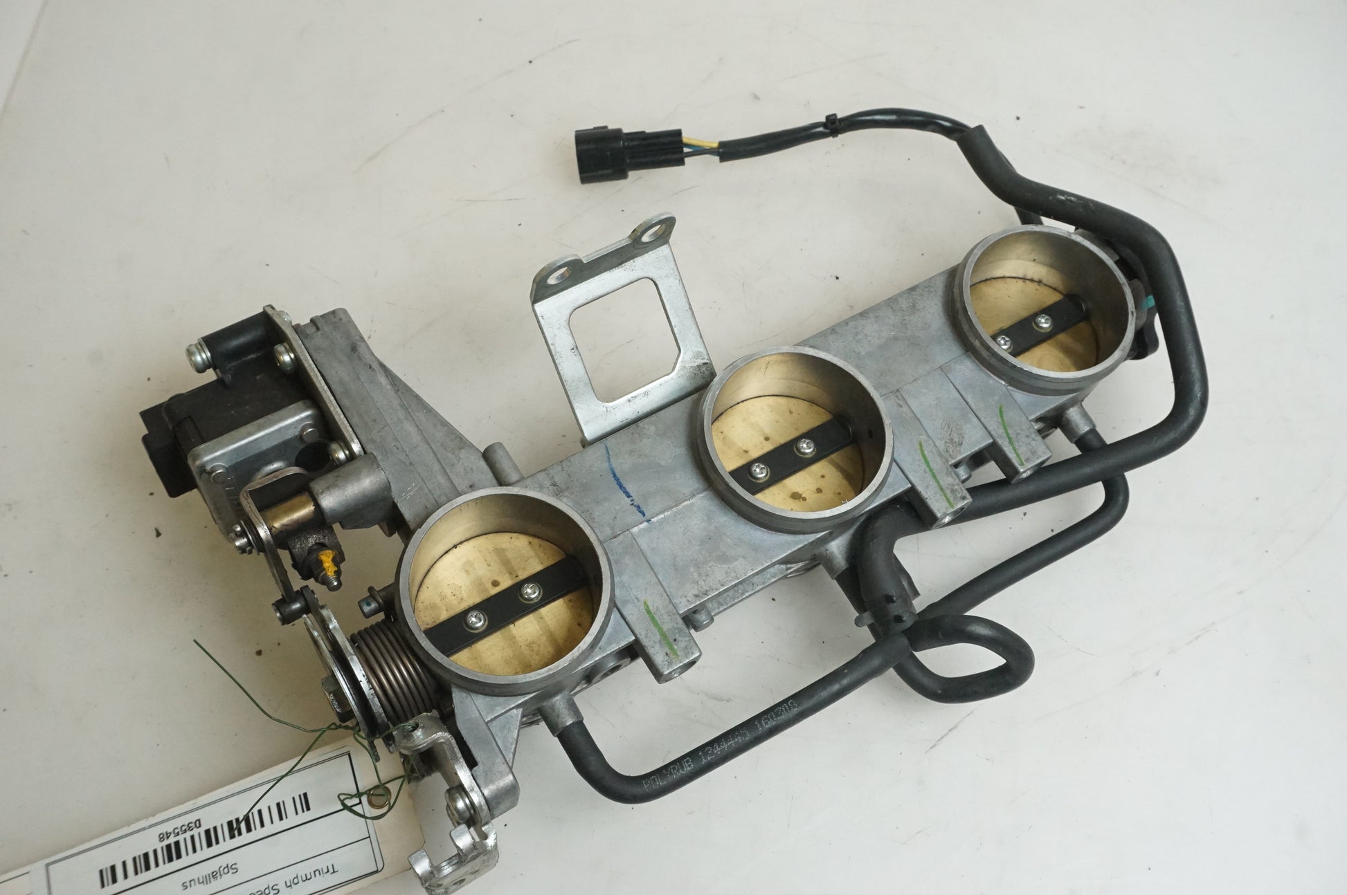 Framsidan på Spjällhus från en Triumph Speed Triple -2009 motorcykel.