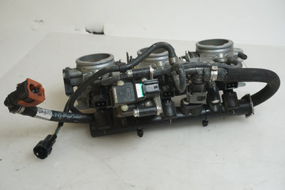 Höger sida på Spjällhus från en Triumph Tiger 800 -2011 motorcykel.