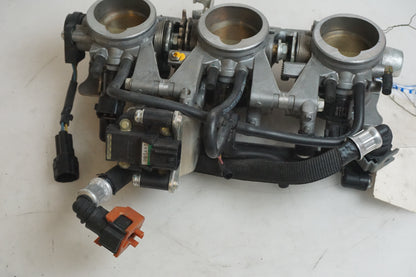 Höger sida på Spjällhus från en Triumph Street Triple -2009 motorcykel.