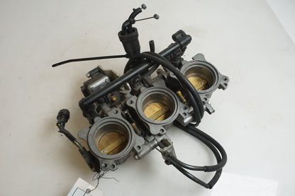 Framsidan på Spjällhus från en Triumph Street Triple R -2009 motorcykel.