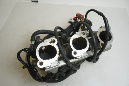 Framsidan på Spjällhus från en Triumph Tiger -2002 motorcykel.