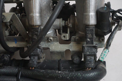 Vänster sida på Spjällhus från en Triumph Tiger -2002 motorcykel.