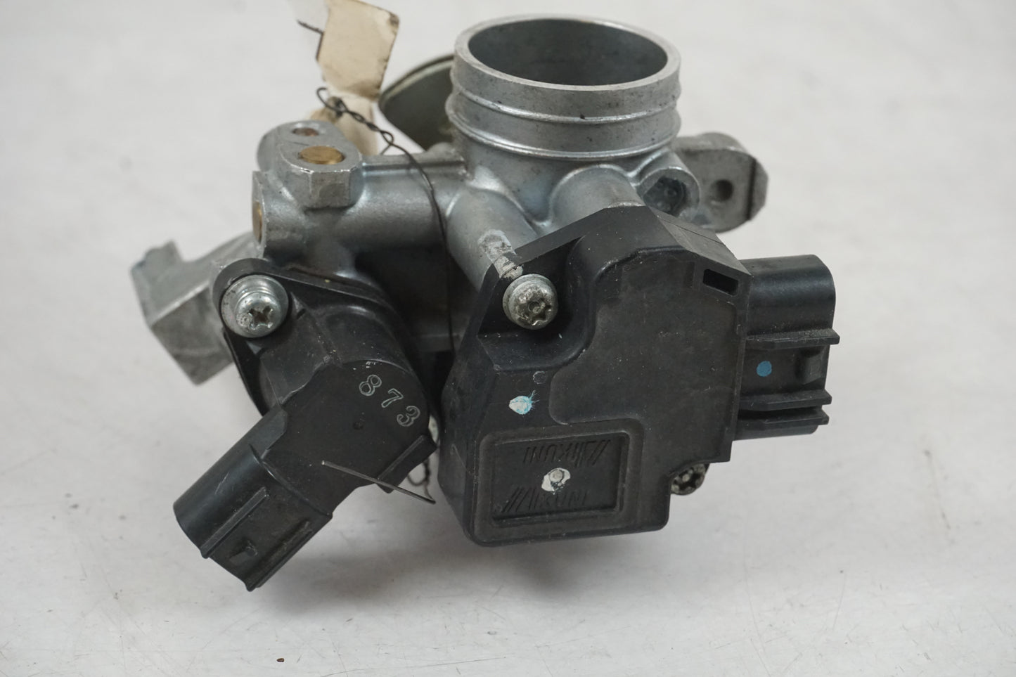 Baksidan på Spjällhus från en Yamaha YZF-R 125 -2009 motorcykel.