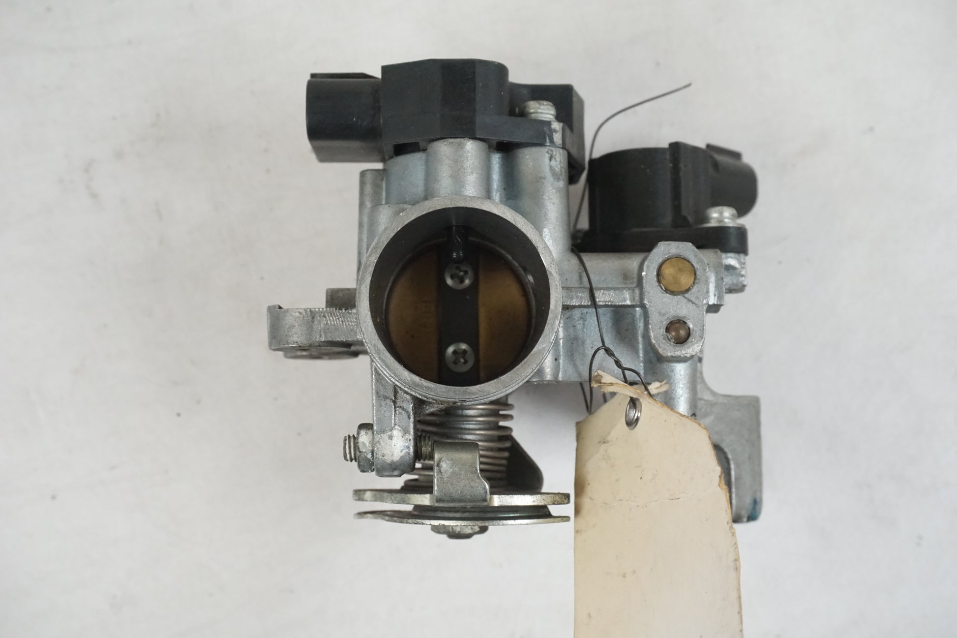 Höger sida på Spjällhus från en Yamaha YZF-R 125 -2009 motorcykel.