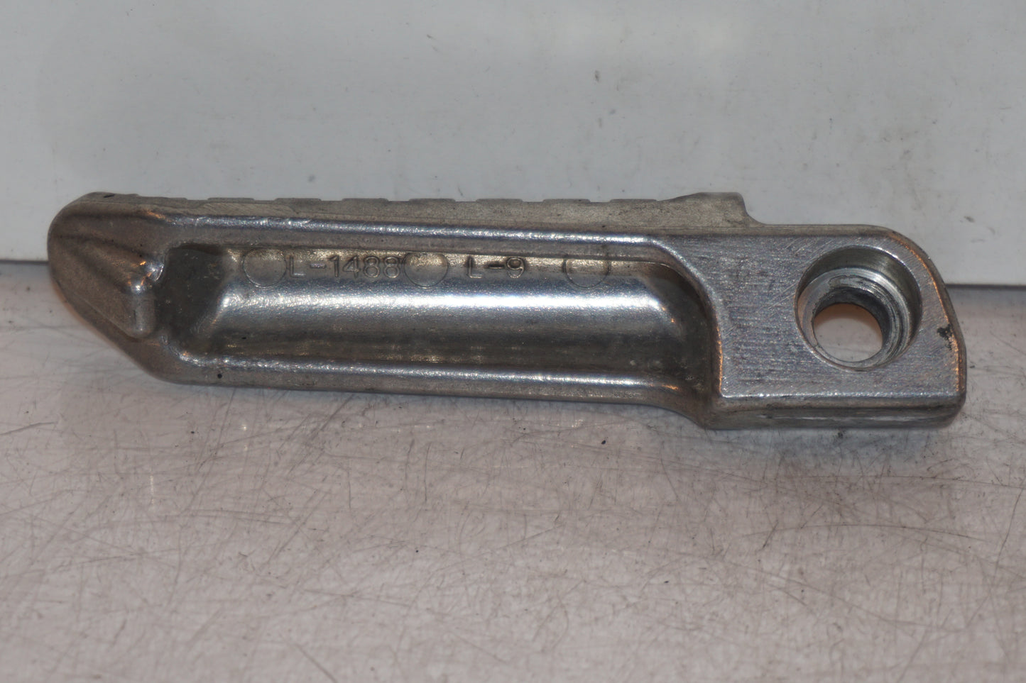 Höger sida på Fotpinne från en Kawasaki Ninja 300 -2014 motorcykel.