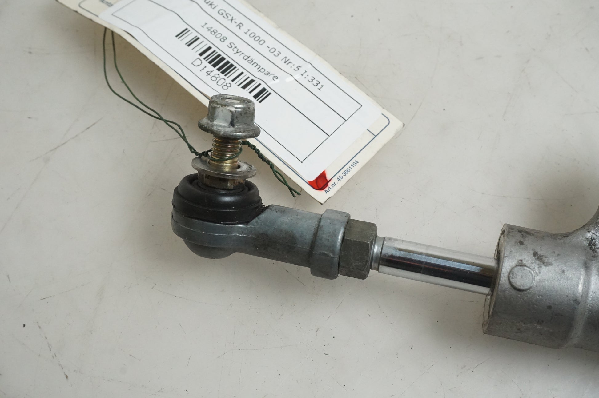 Baksidan på Styrdämpare från en Suzuki GSX-R 1000 -2003 motorcykel.