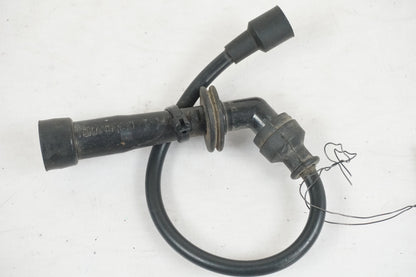 Baksidan på Tändspole från en Suzuki LTA 750 XP E -2009 motorcykel.